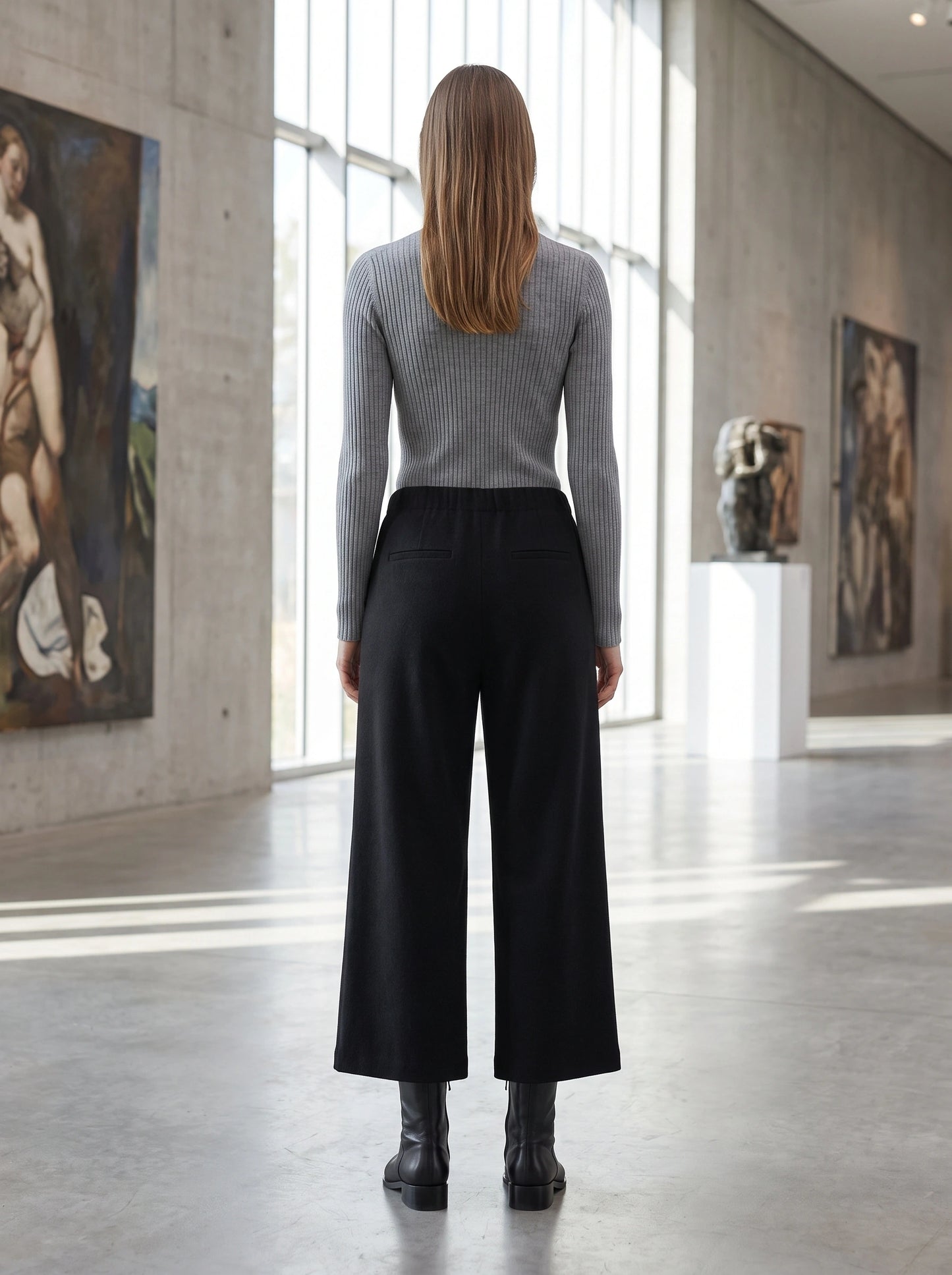 Close up view of the women's tailored autumn cropped trousers showing the fine fabric texture, precise stitching, and design details.