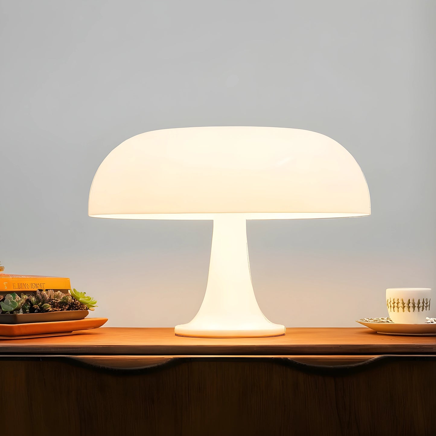 View of a contemporary sculpted acrylic mushroom table lamp in a translucent white finish, showcasing its unique shape and texture