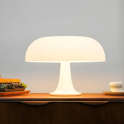 View of a contemporary sculpted acrylic mushroom table lamp in a translucent white finish, showcasing its unique shape and texture