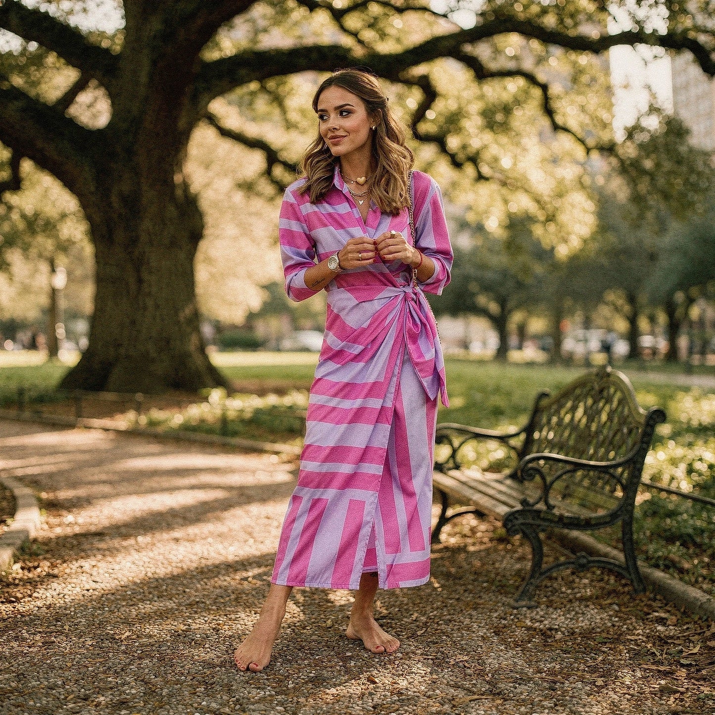 View of a flattering wrap dress featuring a vibrant floral print, short sleeves, and a tie waist in soft fabric