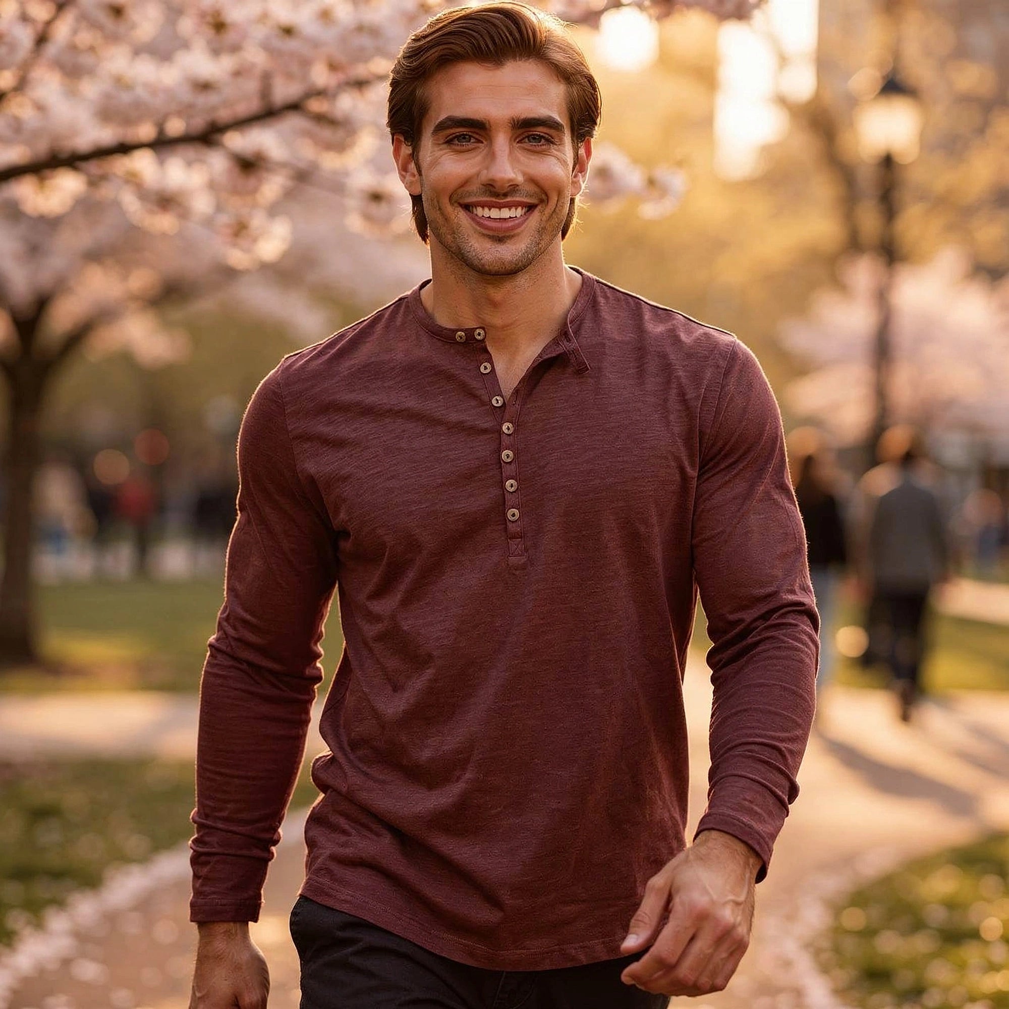 View of a light gray long sleeve henley shirt made of soft cotton, featuring a three button placket and ribbed cuffs