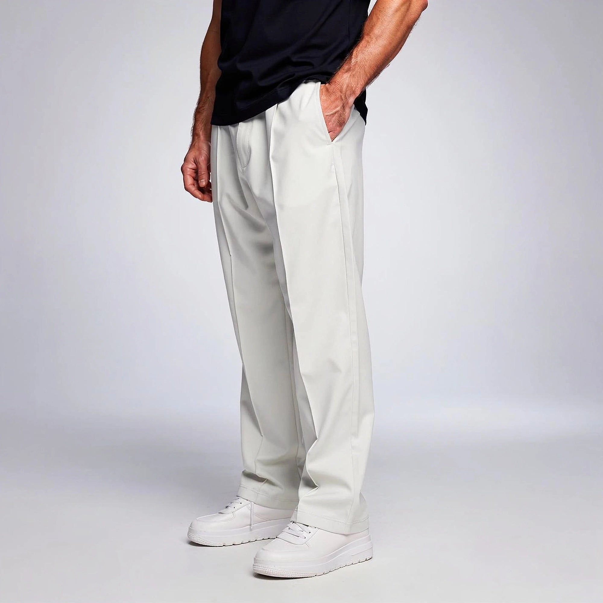 View of comfortable loose fit formal trousers in charcoal gray, featuring a smooth fabric and relaxed waistband