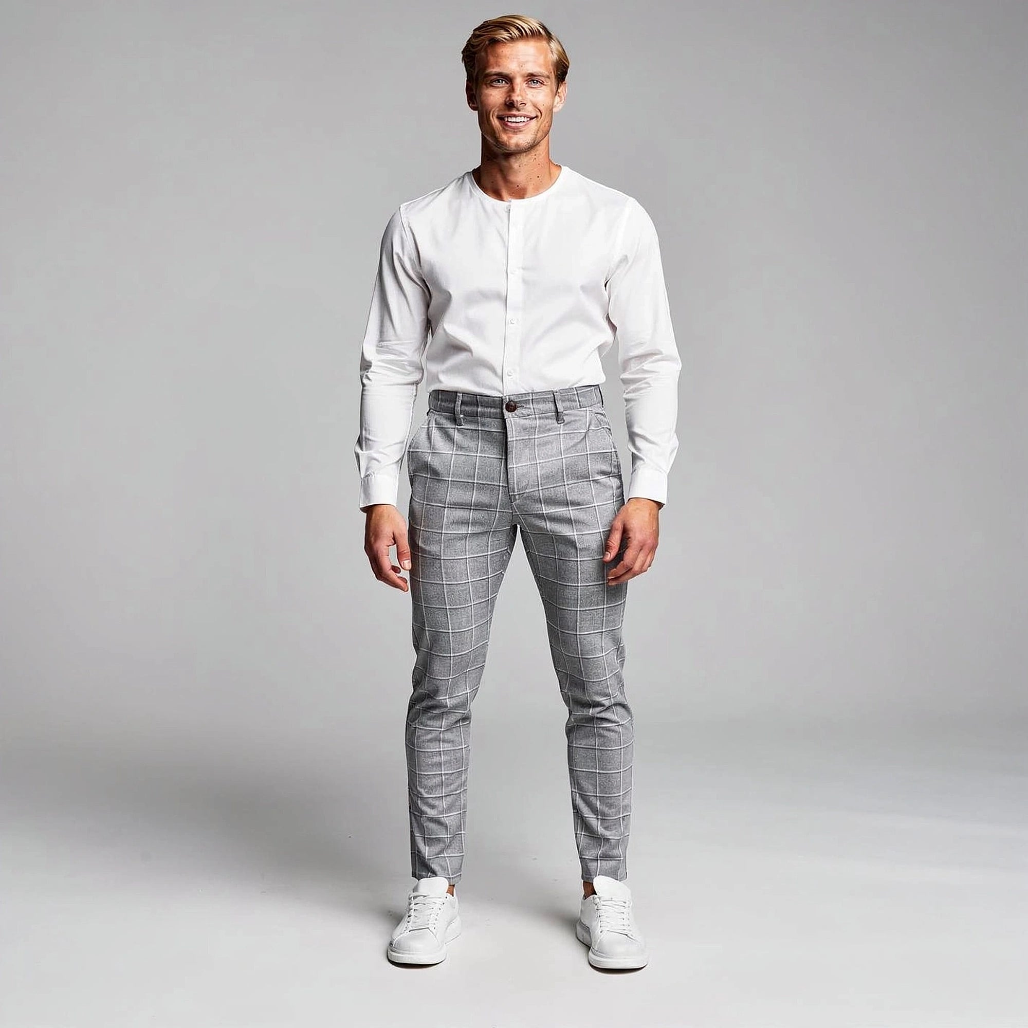 View of modern tailored tapered trousers in charcoal gray, featuring a smooth fabric and sleek design