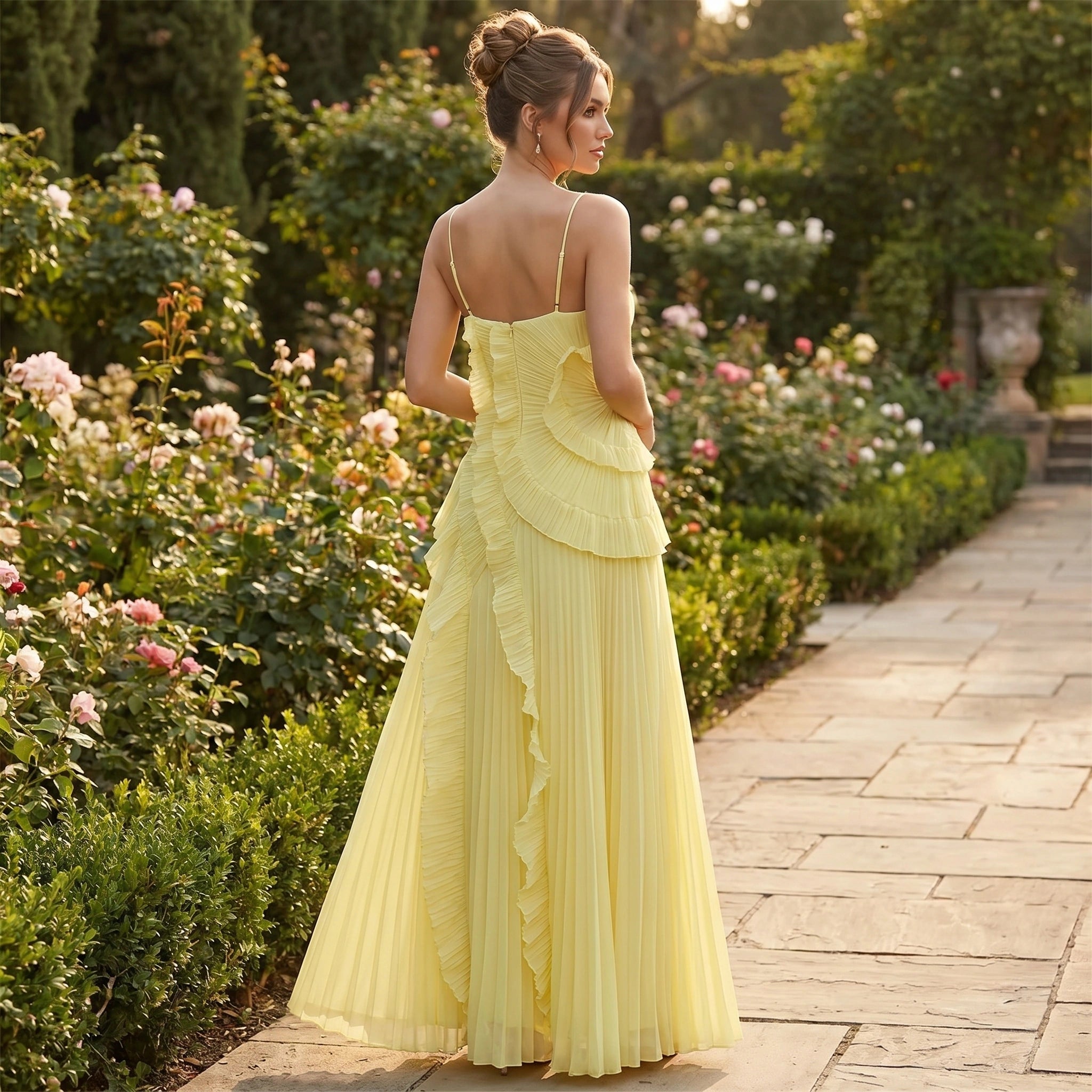 Full front view of a model wearing a womens pleated maxi dress in a soft pastel color, styled with minimal accessories against a neutral background.