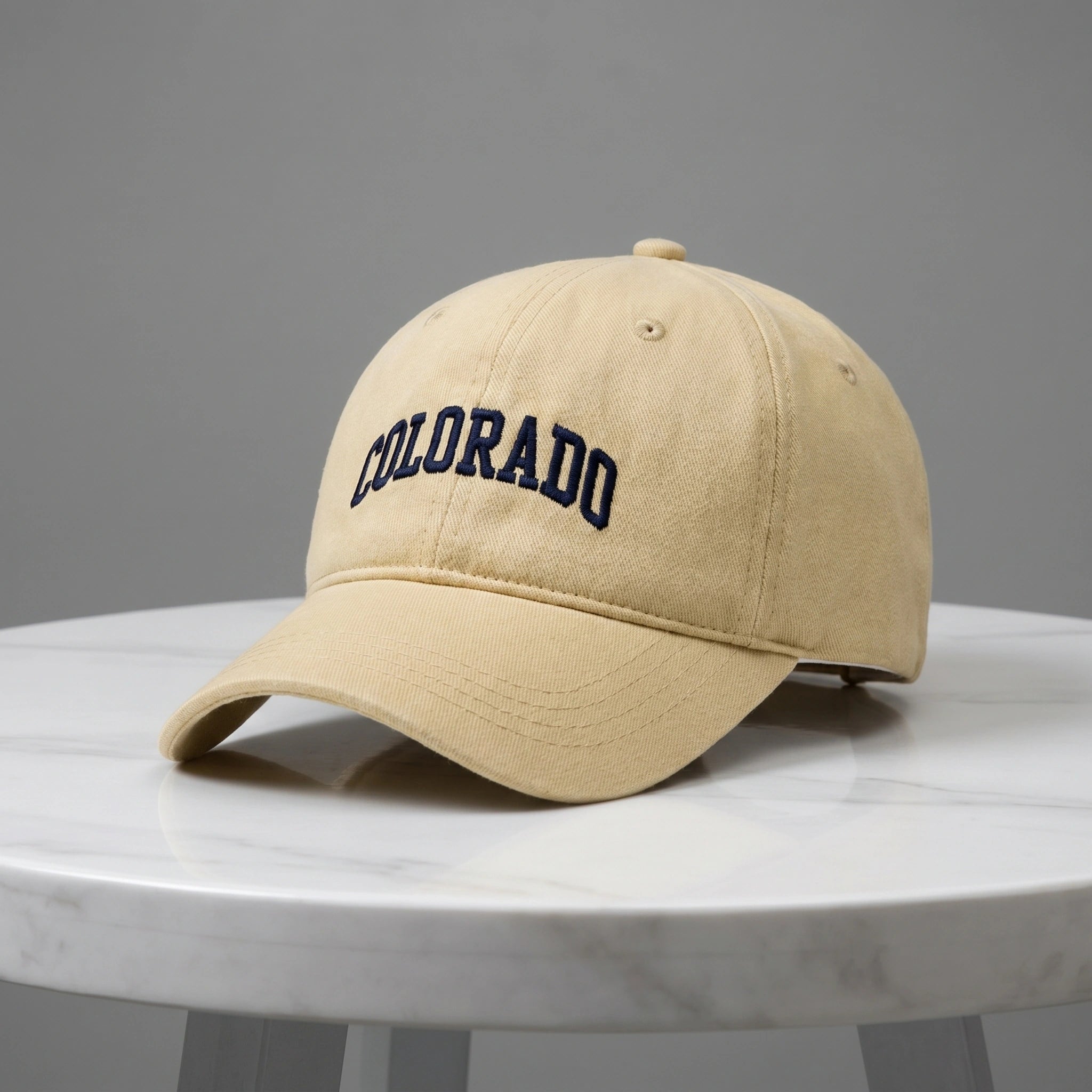 Close up view of the CanyonPeak baseball cap's durable fabric and precise stitching, showing its high quality craftsmanship and versatile design for outdoor adventures.