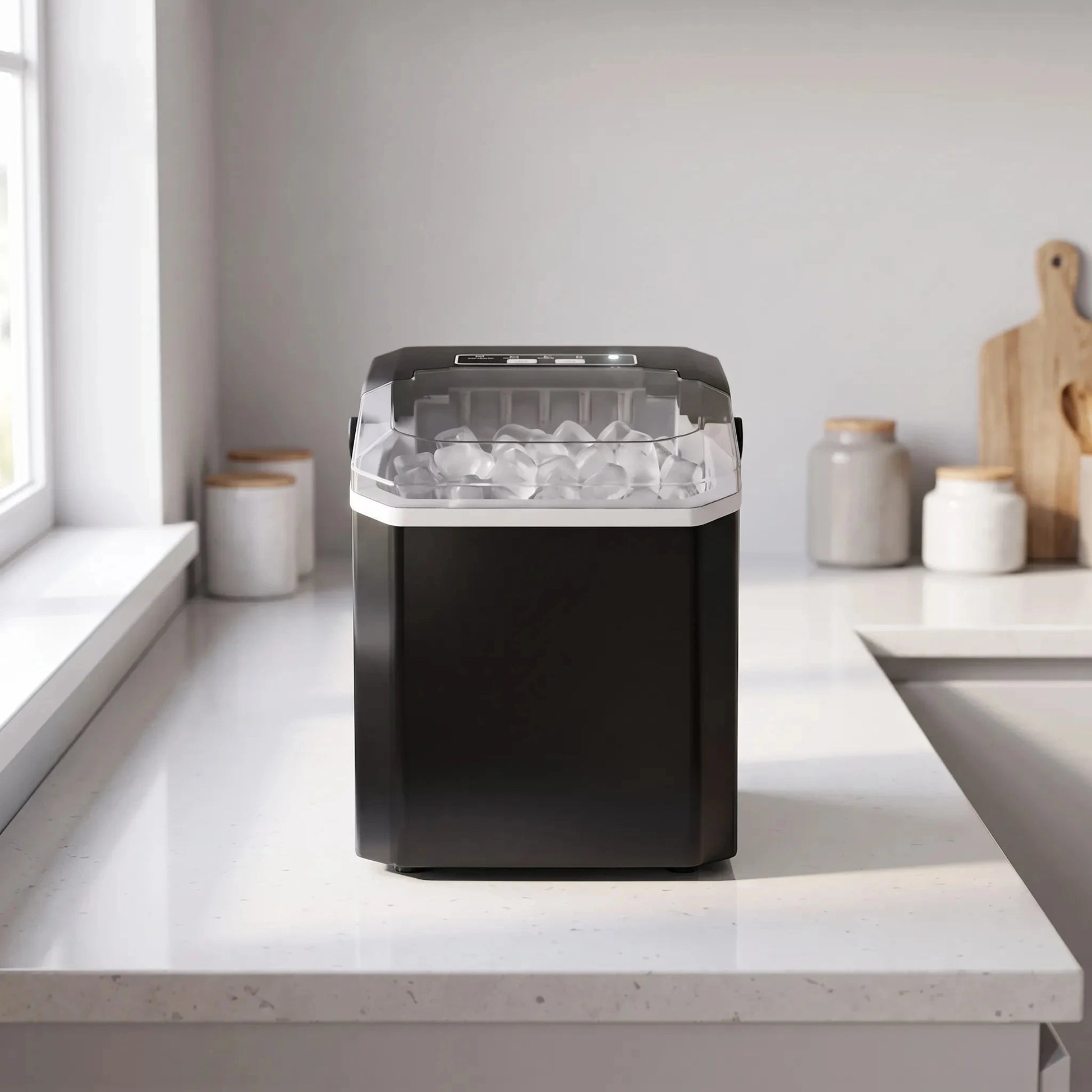 View of a sleek portable ice maker featuring a user friendly control panel and a clear ice bin for easy access