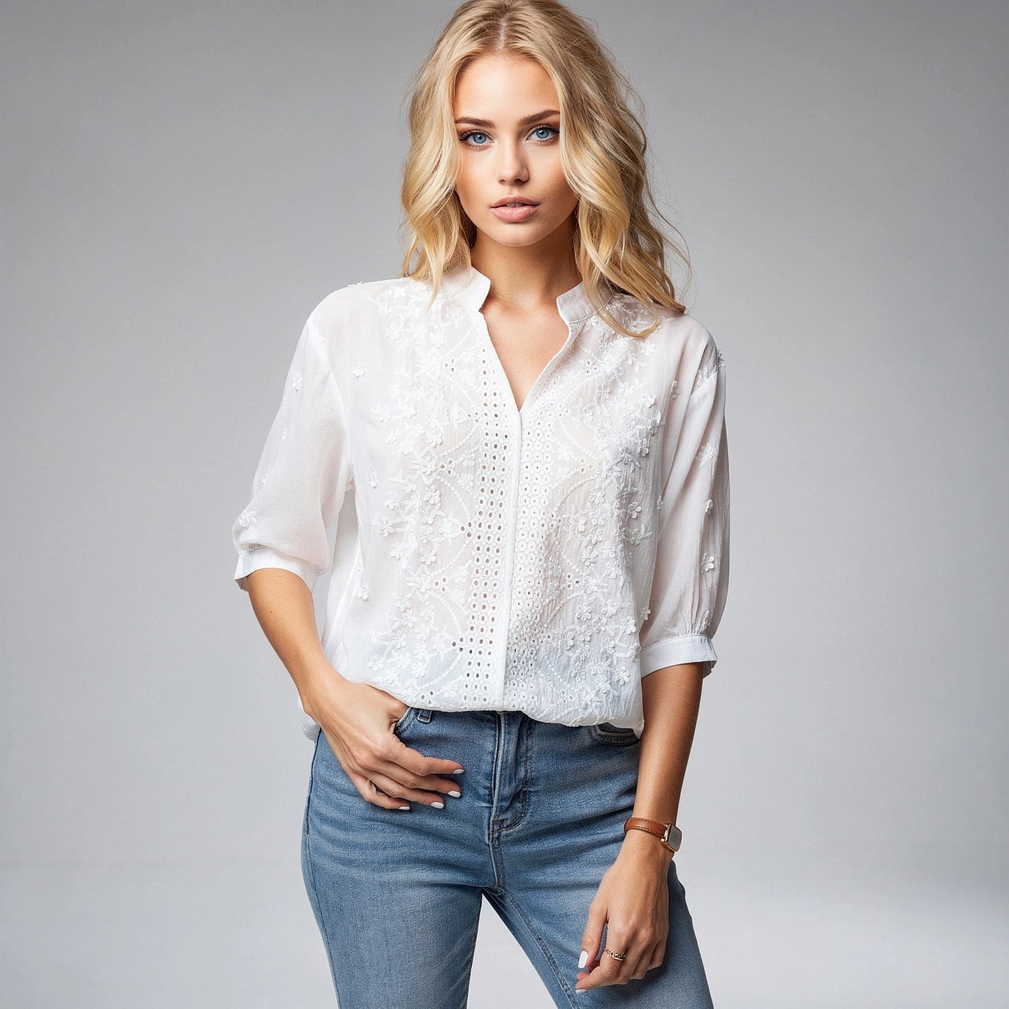 Light pink blouse with a V neck and puff sleeves, featuring a view that highlights its airy fabric and elegant design