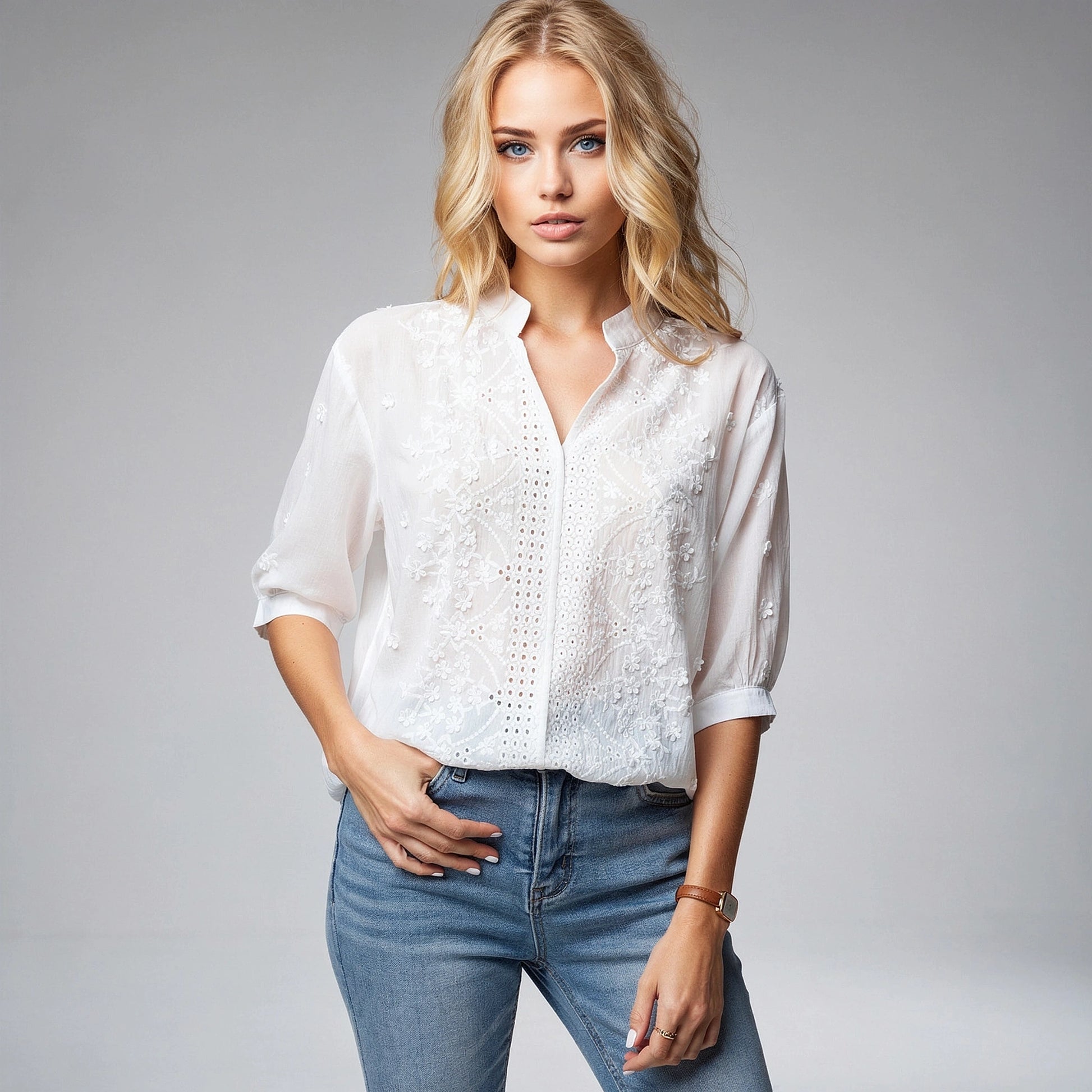 Light pink blouse with a V neck and puff sleeves, featuring a view that highlights its airy fabric and elegant design