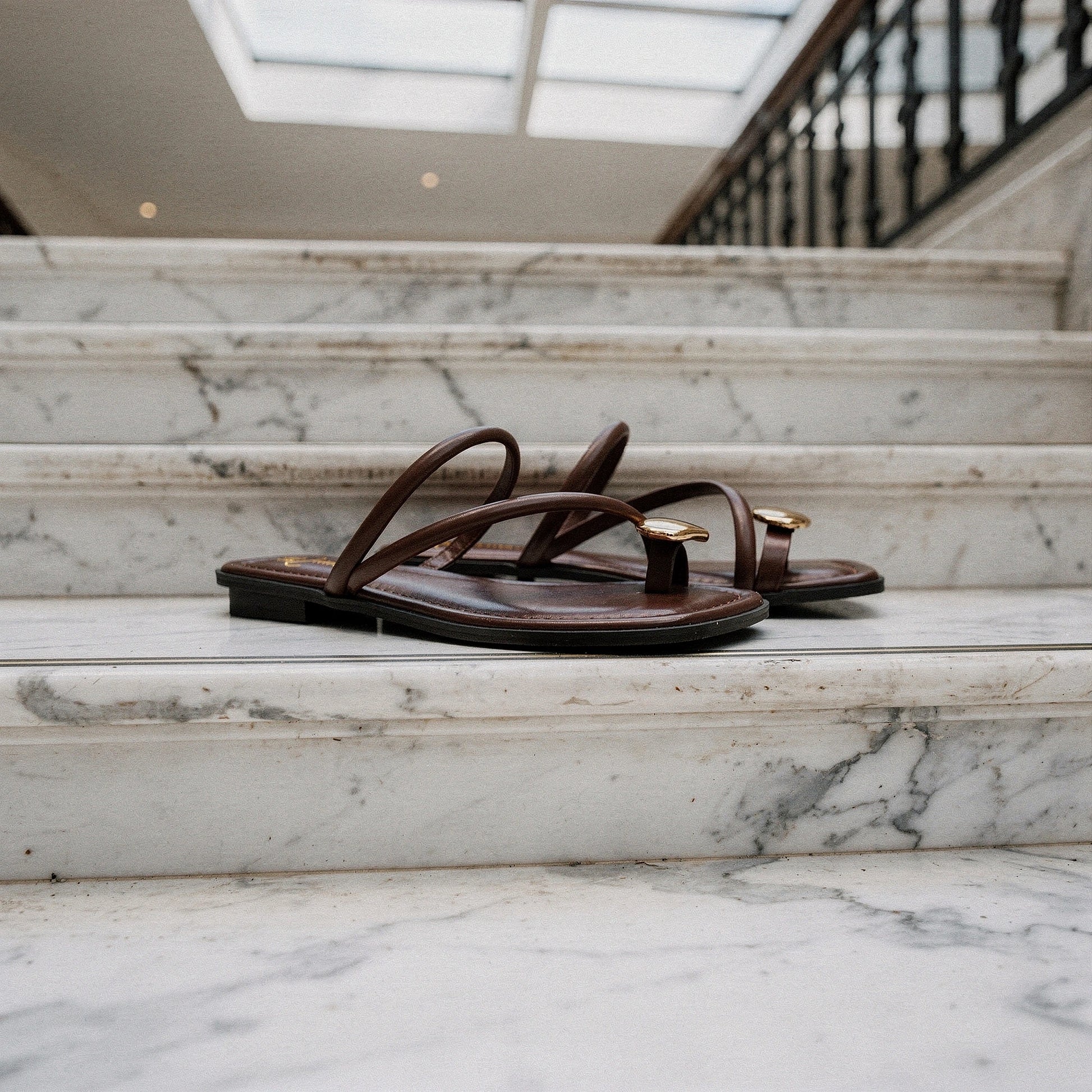 View of women's casual summer slides in soft beige, featuring a comfortable open toe design and a cushioned footbed