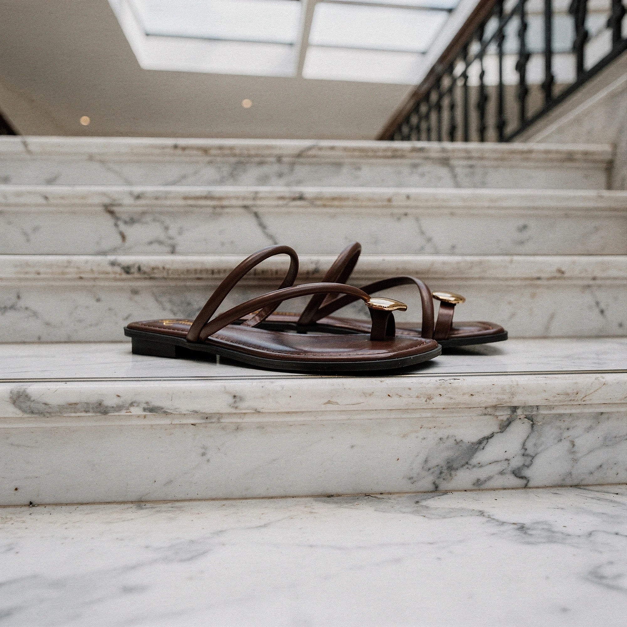 View of women's casual summer slides in soft beige, featuring a comfortable open toe design and a cushioned footbed