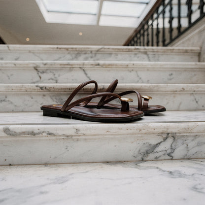 View of women's casual summer slides in soft beige, featuring a comfortable open toe design and a cushioned footbed