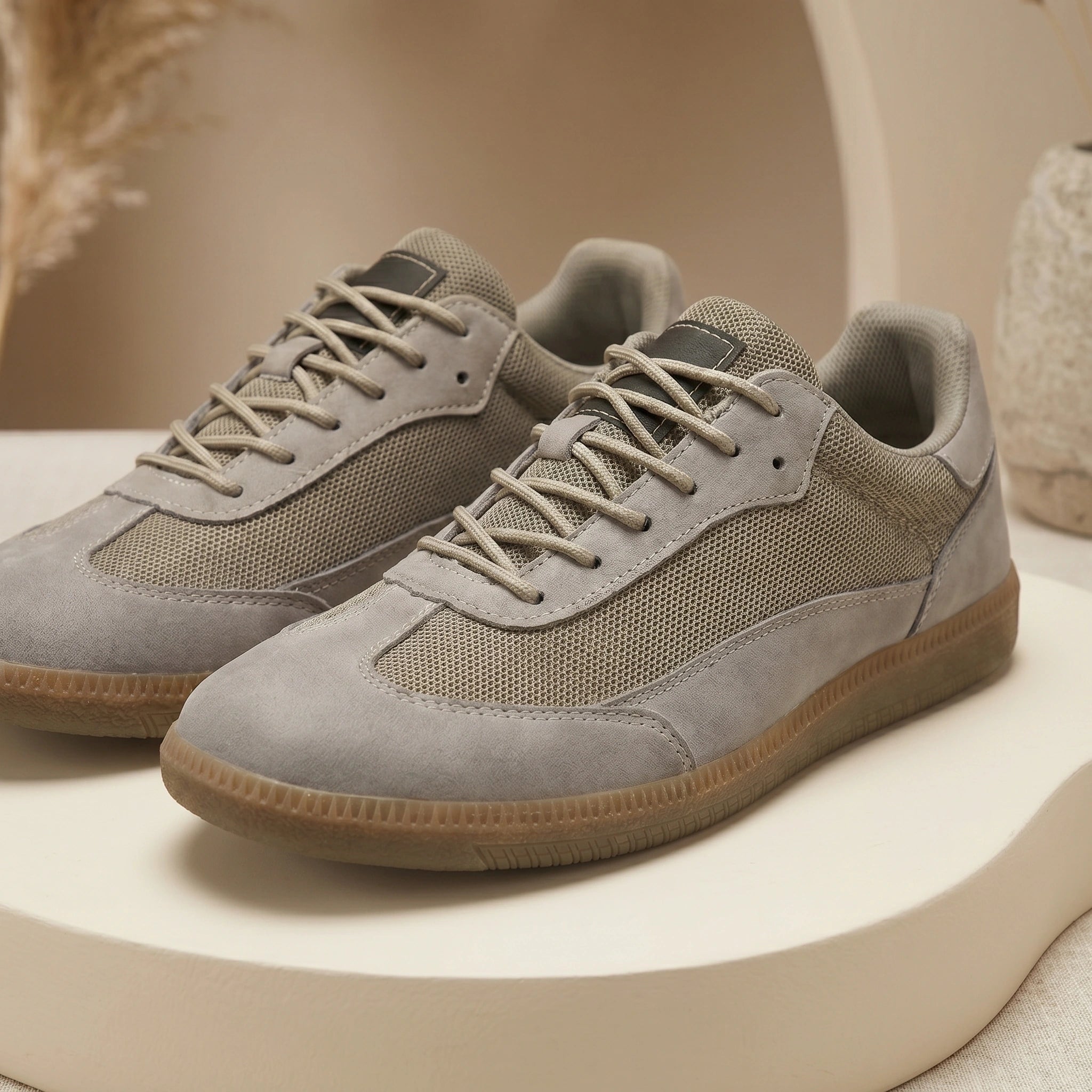 Full front view of a model showing Mens Classic Lace Up Sneakers, paired with a casual outfit showing a light colored shirt and dark jeans against a neutral background.