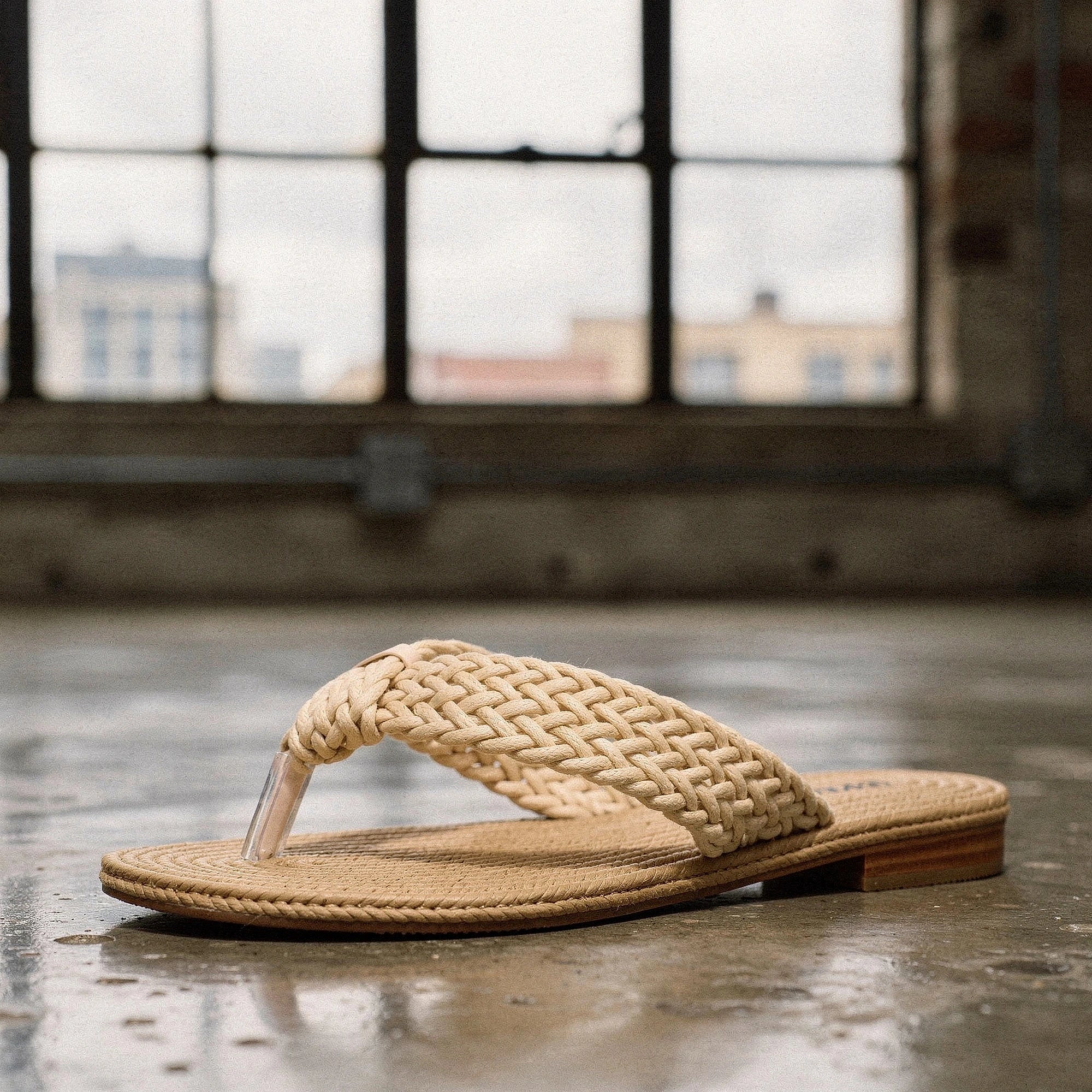 View of relaxed textured imitation hemp flip flops in light beige, featuring a comfortable footbed and durable sole