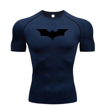 View of a fitted men's athletic compression running tee in dark gray, made from moisture wicking fabric with short sleeves