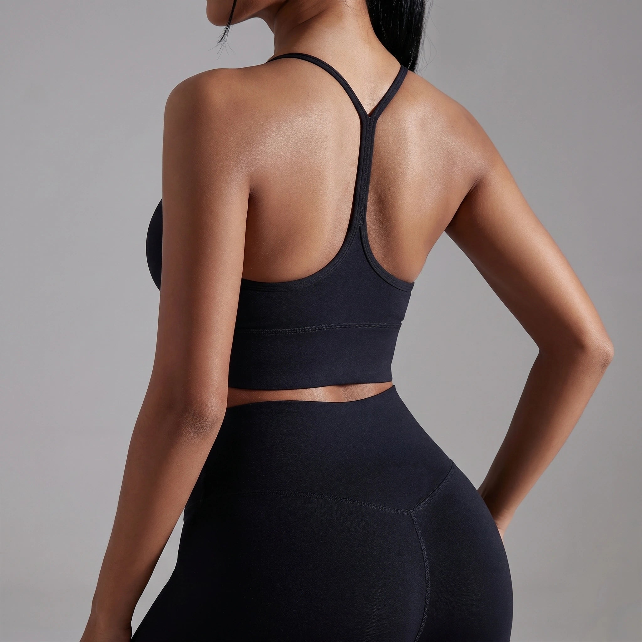 Close up view of the women's soft supportive athletic bra showing its breathable fabric, intricate stitching, and design perfect for gym and yoga sessions.