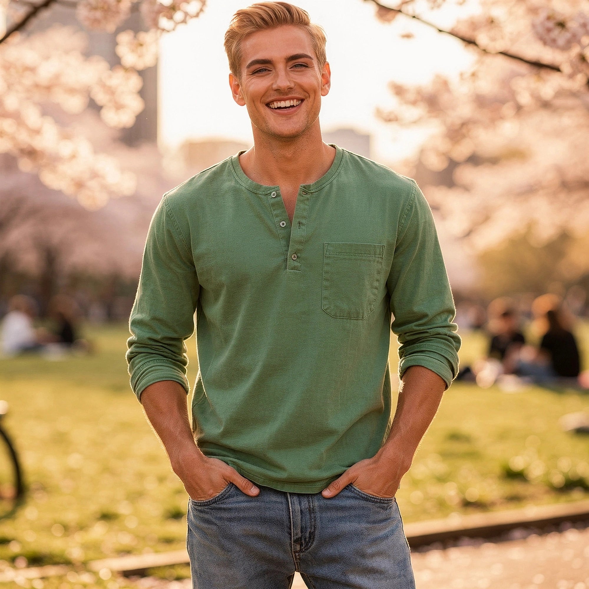 View of a light gray long sleeve henley shirt made from soft cotton, featuring a three button placket and ribbed cuffs