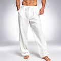 View of relaxed drawstring pants in light gray fabric, featuring an elastic waistband and pockets