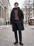 Close up view of the men's oversized winter overcoat showing the luxurious fabric texture and precise stitching details against a neutral background.