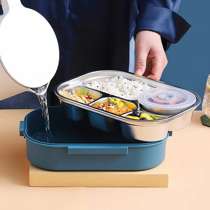 View of a modern stainless steel lunch box featuring a sleek design, durable material, and secure lid for travel