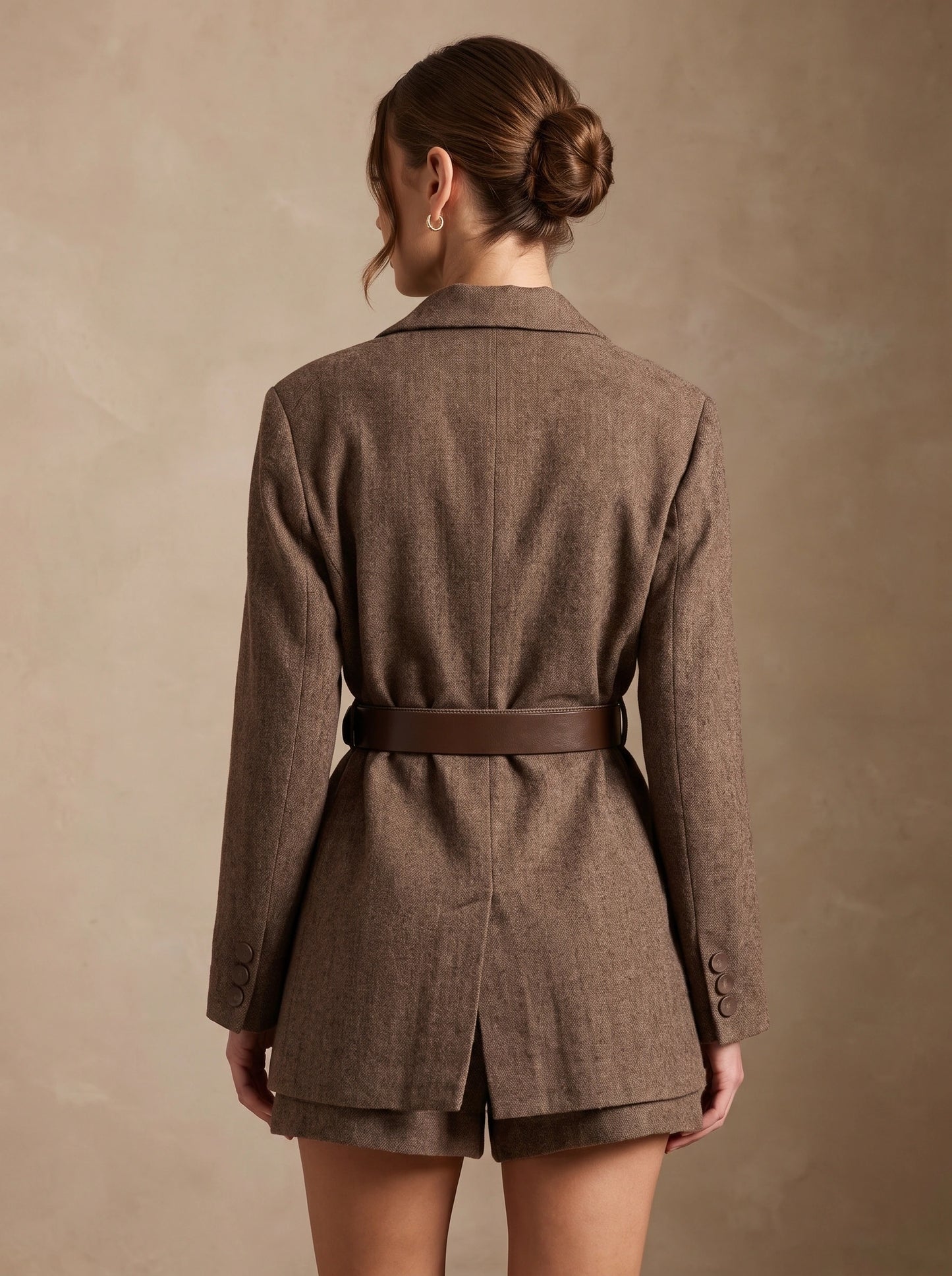 Close up of the Womens Tailored Blazer showing the fine stitching and luxurious fabric, showing its sophisticated design and silhouette.