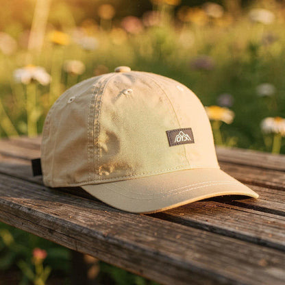 View of a stylish men's baseball cap in dark gray, made from breathable fabric, featuring a curved brim and ventilation holes