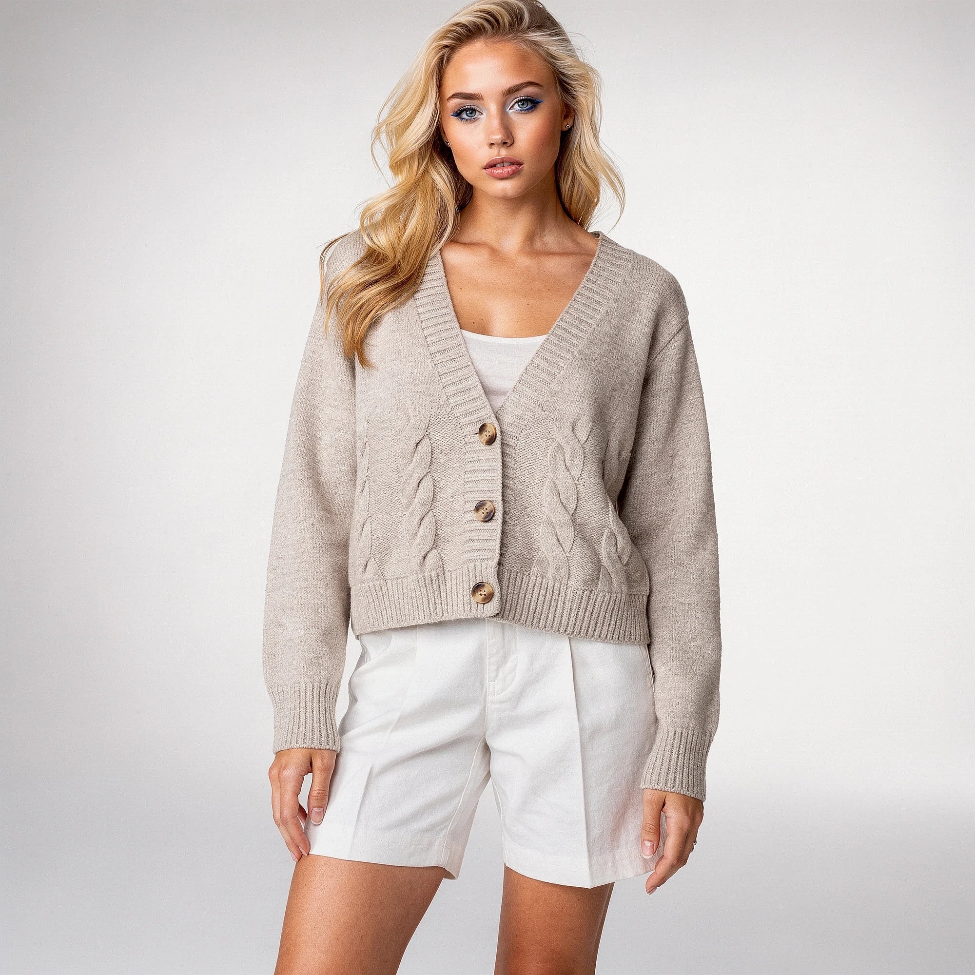 Light gray cropped knitted sweater featuring a twisted , view highlighting the soft texture