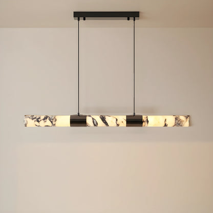 Front view of the AlabasterGlow chandelier, showing its elongated marble design, perfect for enhancing sophisticated dining room aesthetics.
