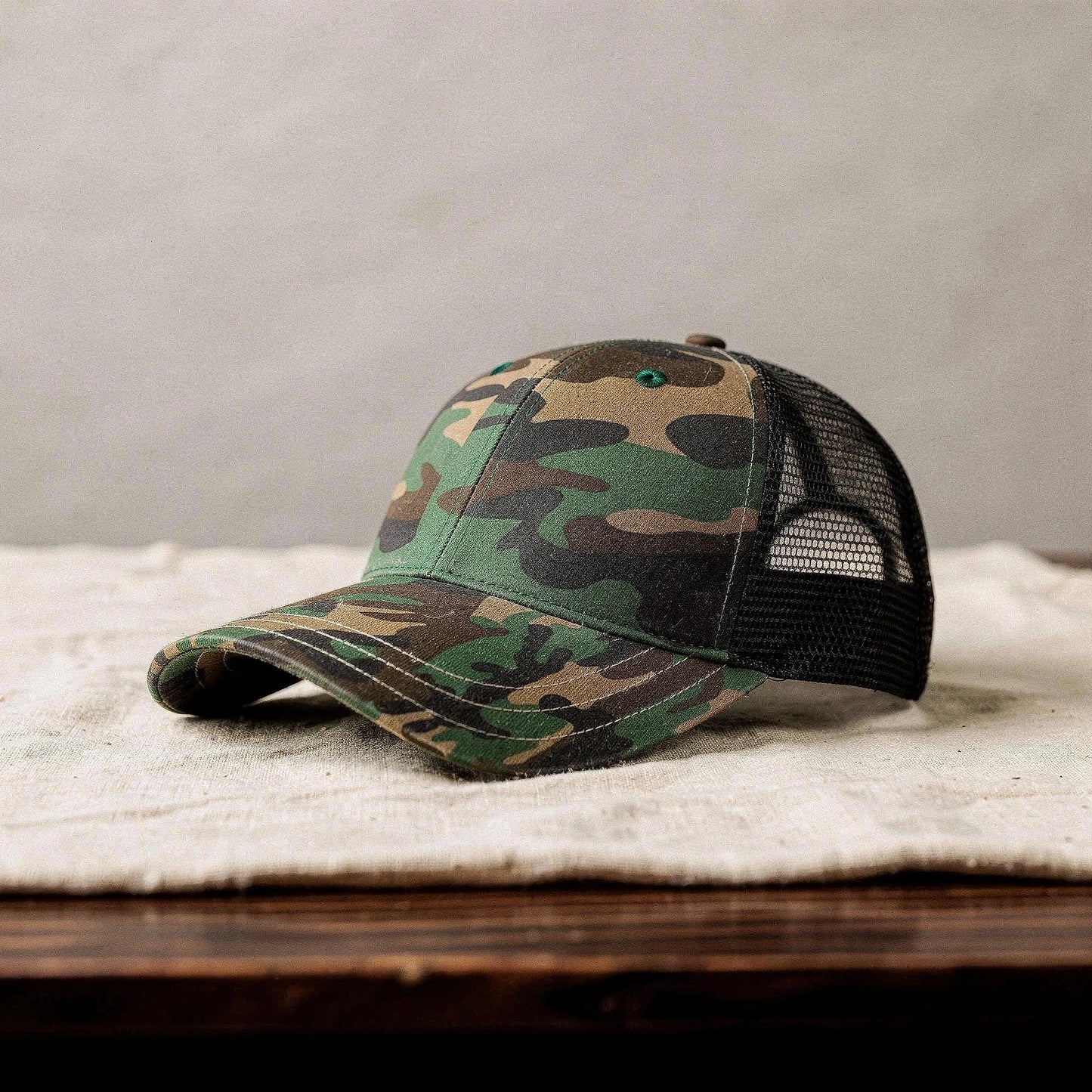 View of a relaxed vintage snapback cap in dark gray, featuring a textured fabric and adjustable strap