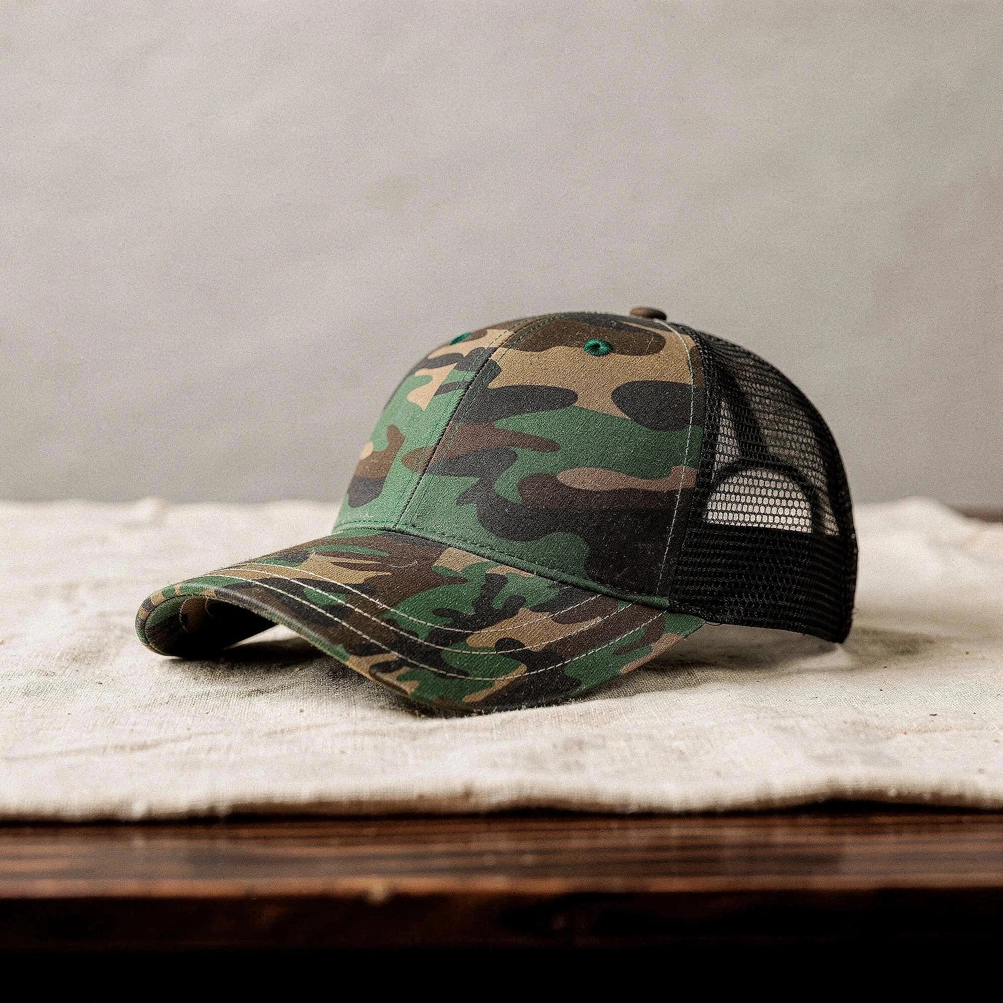 View of a relaxed vintage snapback cap in dark gray, featuring a textured fabric and adjustable strap