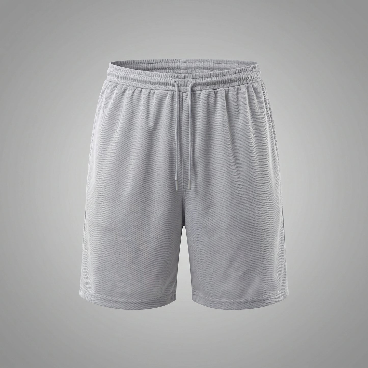 Close up view of the lightweight fabric and precise stitching of men's modern fit athletic shorts, showing their quality and performance features against a neutral background.