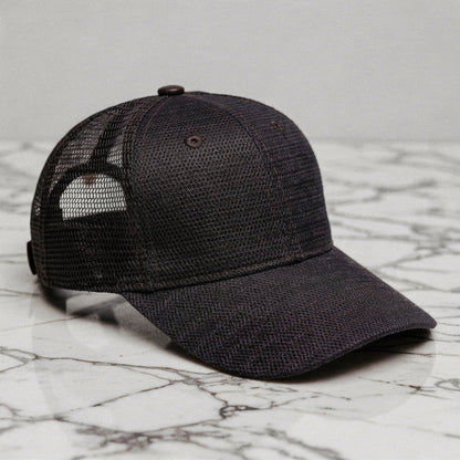 Relaxed vintage snapback cap in dark gray with a textured fabric and adjustable strap, detailed view highlighting stitching and design