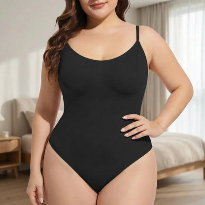 Black thong bodysuit with spaghetti straps, seamless design, indoor setting