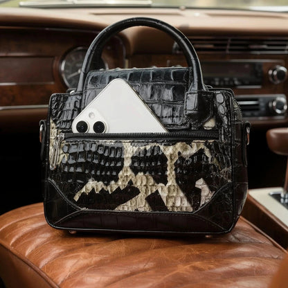 View of a chic textured leather shoulder bag in deep burgundy, featuring a spacious interior and elegant stitching