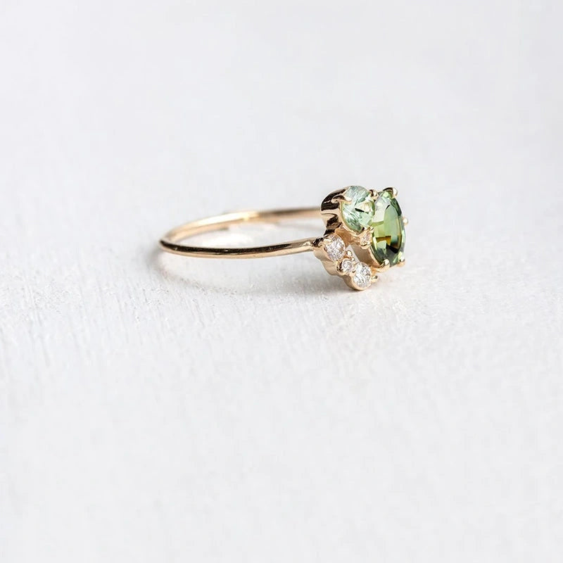 Delicate zircon ring featuring a shimmering peridot stone, intricate band design, detailed view showcasing craftsmanship