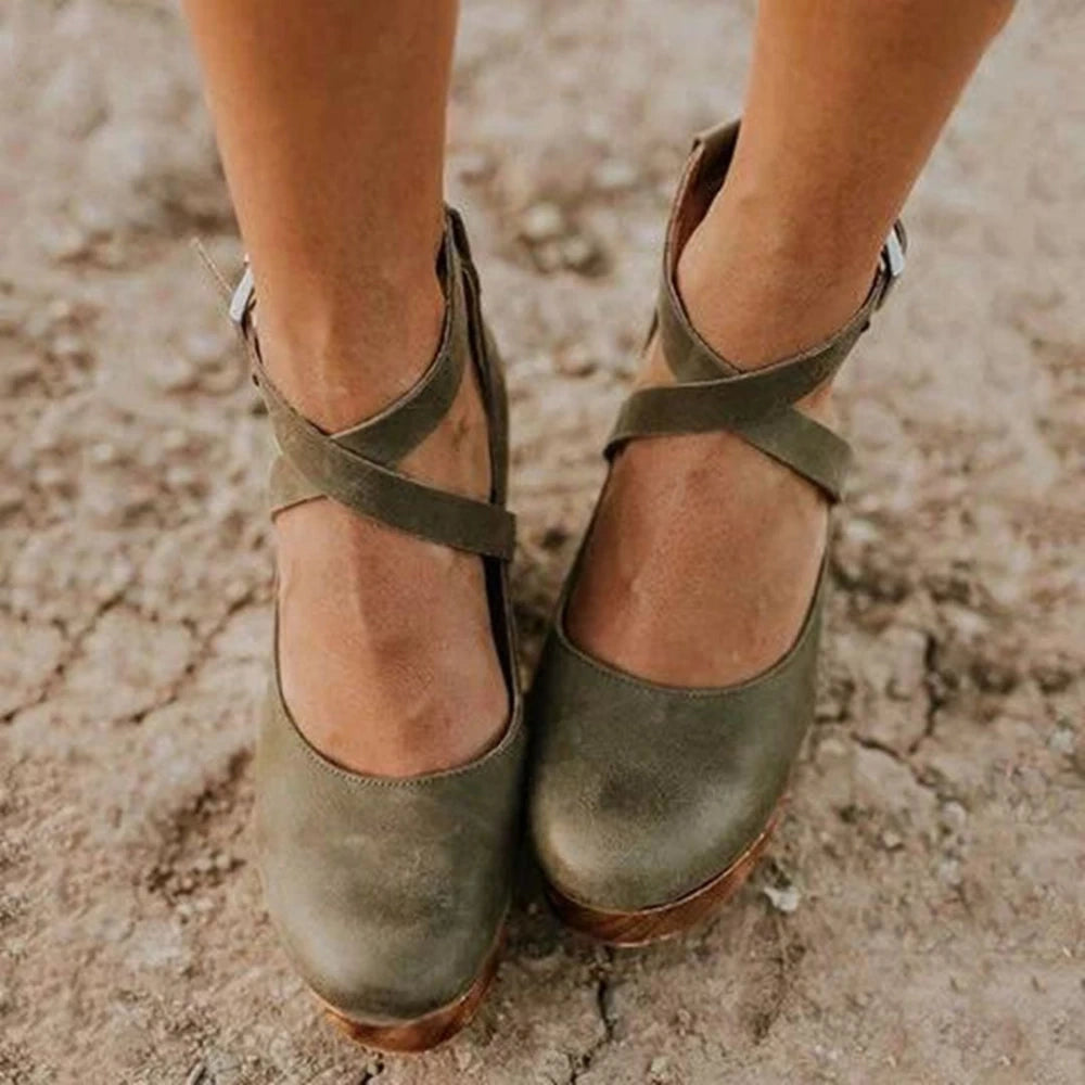 View of elegant summer sandal in soft beige leather, featuring a delicate strap design and a comfortable flat sole