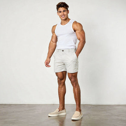 View of men's athletic fit stretch chino shorts in light beige, featuring a comfortable waistband and pockets
