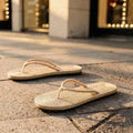 View of chic casual straw flip flop sandals in beige, featuring a woven straw upper and comfortable footbed