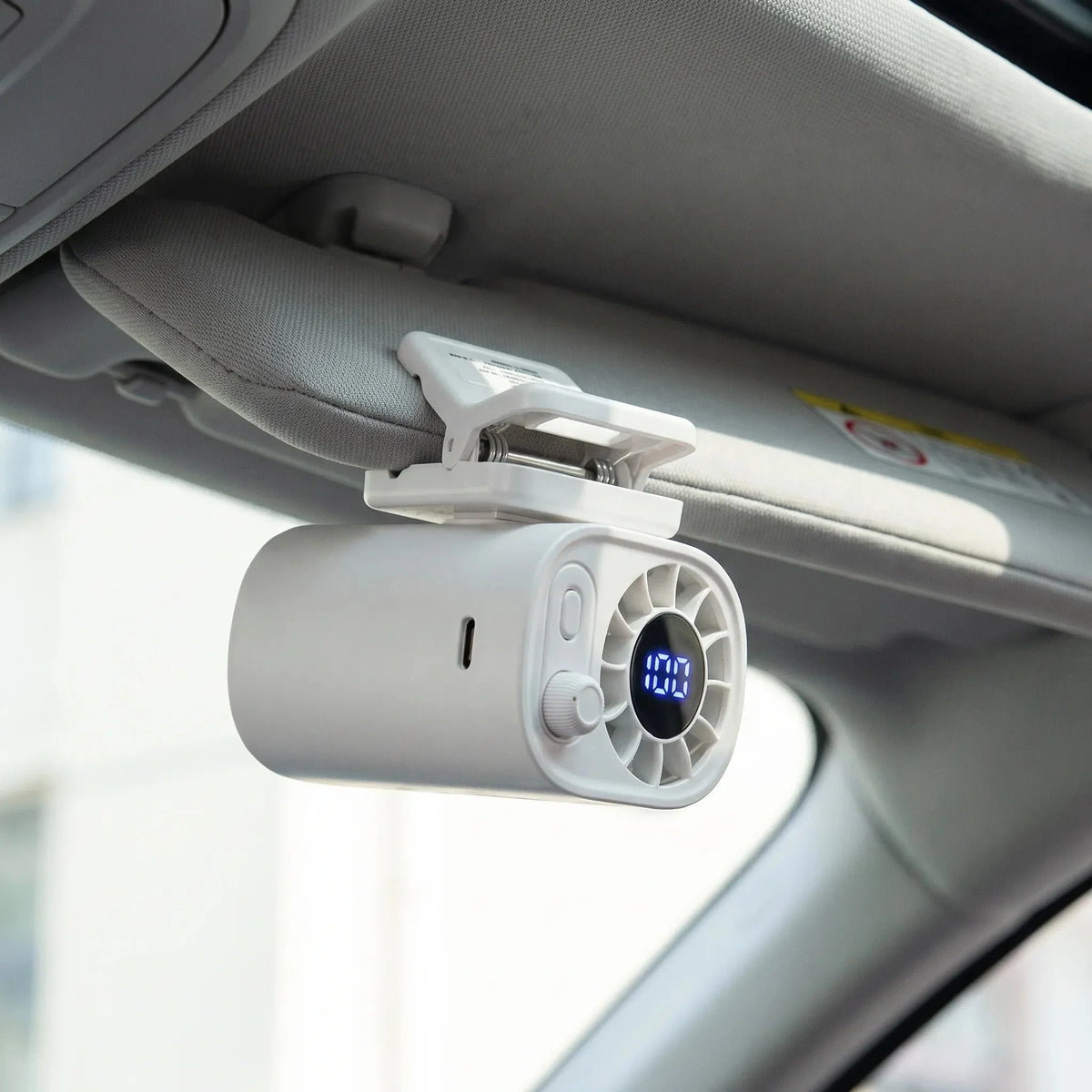 Compact clip on fan with a sleek design, featuring adjustable airflow and a rotating head for optimal cooling