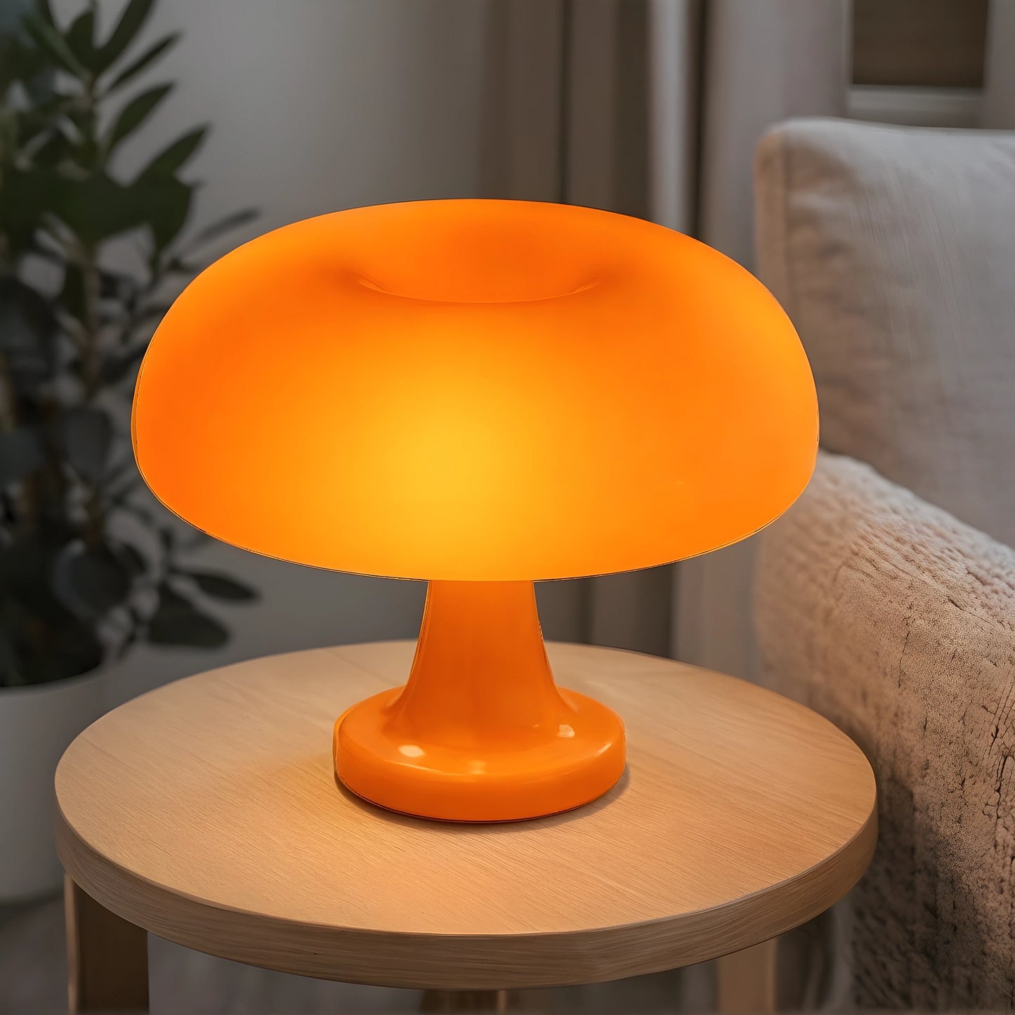 View of a contemporary sculpted acrylic mushroom table lamp in a translucent white finish with a smooth, rounded shape
