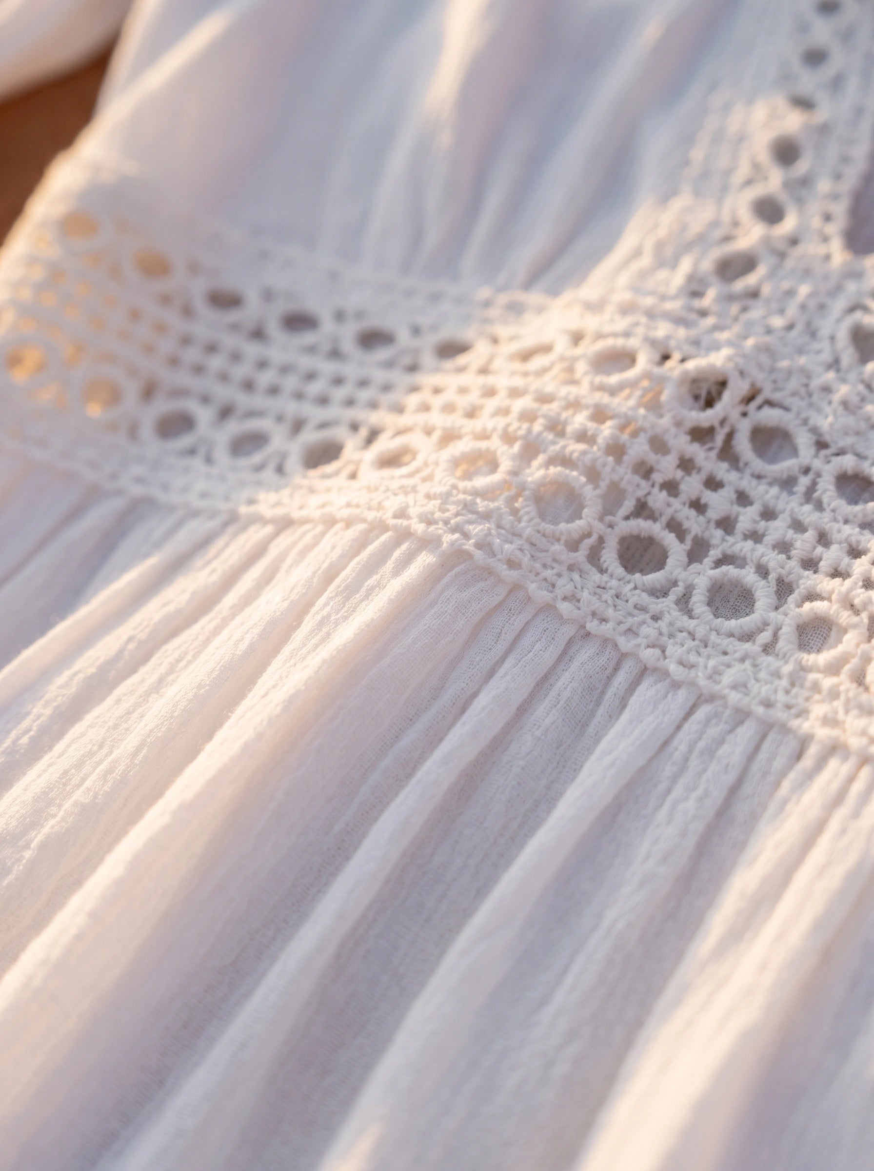 Close up view of the Womens Breezy Summer Dress showing its lightweight fabric, delicate stitching, and flowing silhouette against a soft beach background.