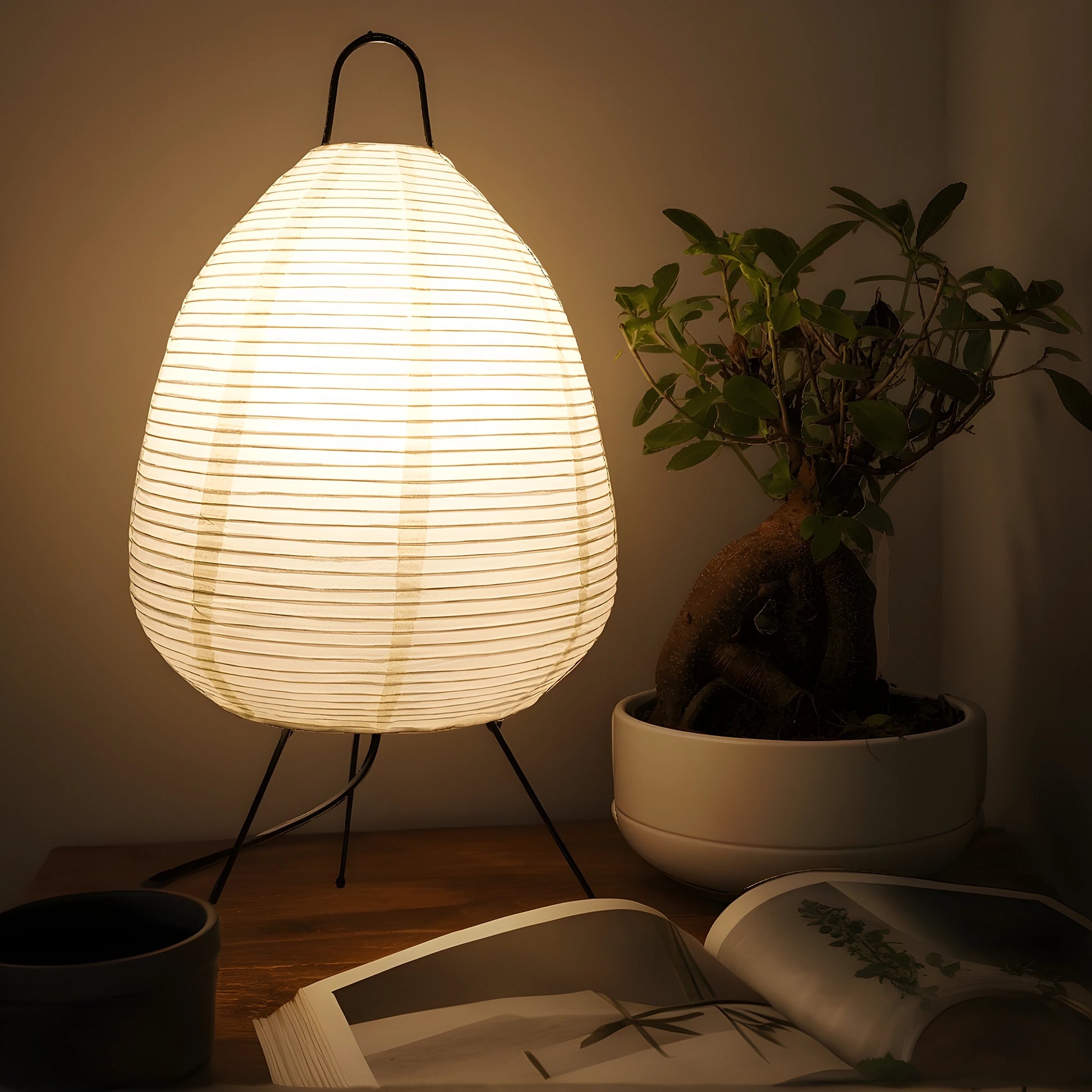 View of a serene minimalist rice paper table lamp, featuring a soft white shade and a natural wood base, ideal for living room decor