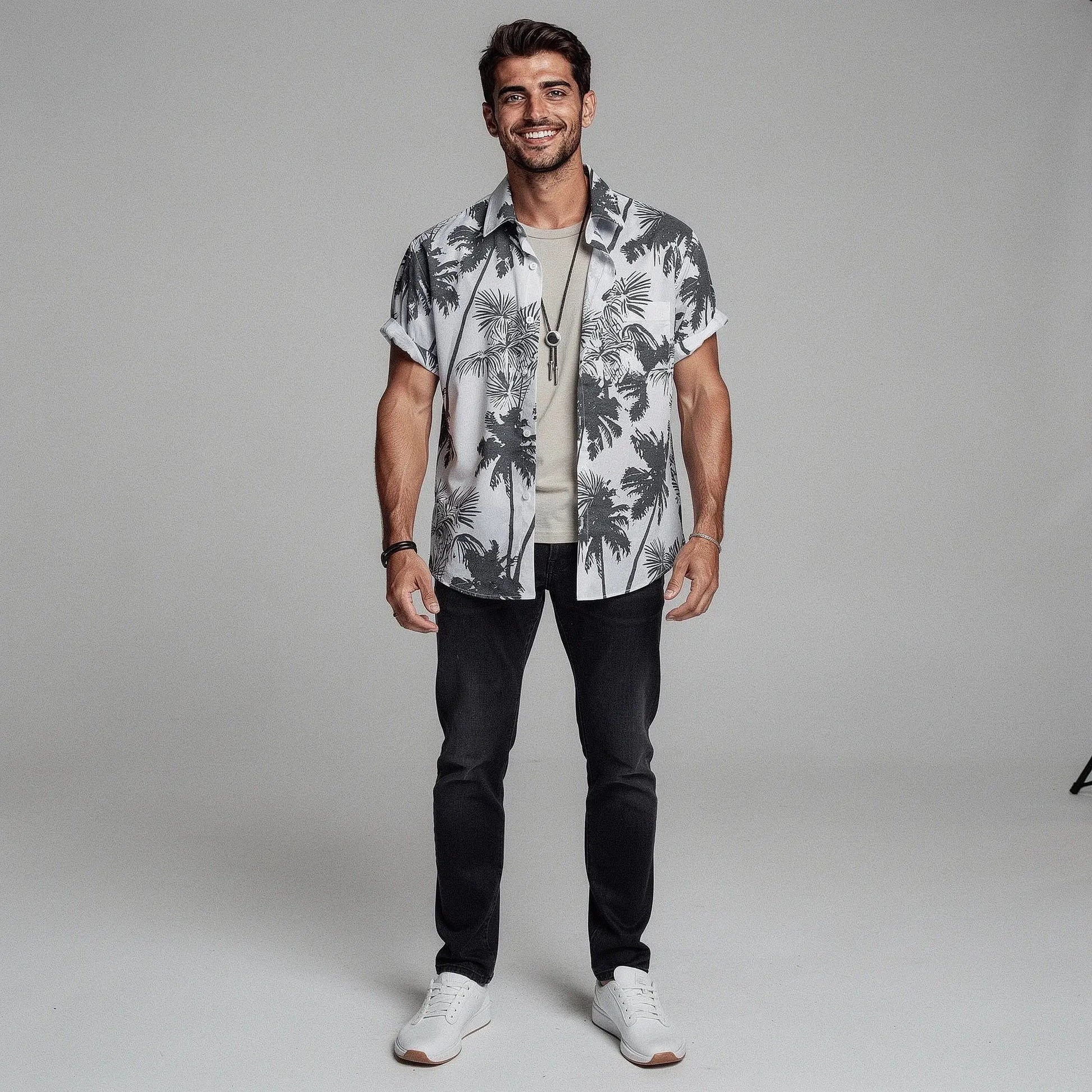 View of a slim fit short sleeve Hawaiian shirt featuring a vibrant floral print in shades of blue and green