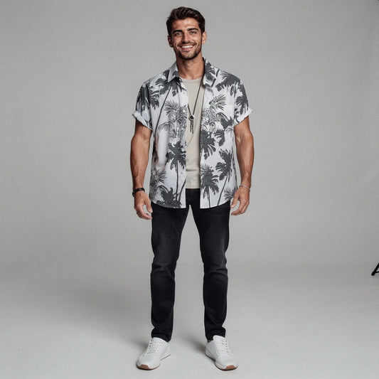 View of a slim fit short sleeve Hawaiian shirt featuring a vibrant floral print in shades of blue and green