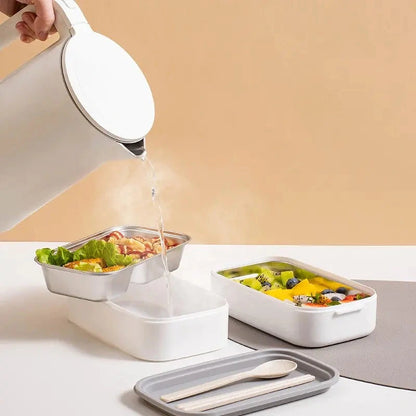 View of a sleek stainless steel double layer lunch box featuring a smooth silver finish and secure lid, showcasing its modern design