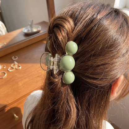Close up view of the Womens Refined Hair Clip showing intricate stitching and a luxurious fabric finish, perfect for enhancing any hairstyle.