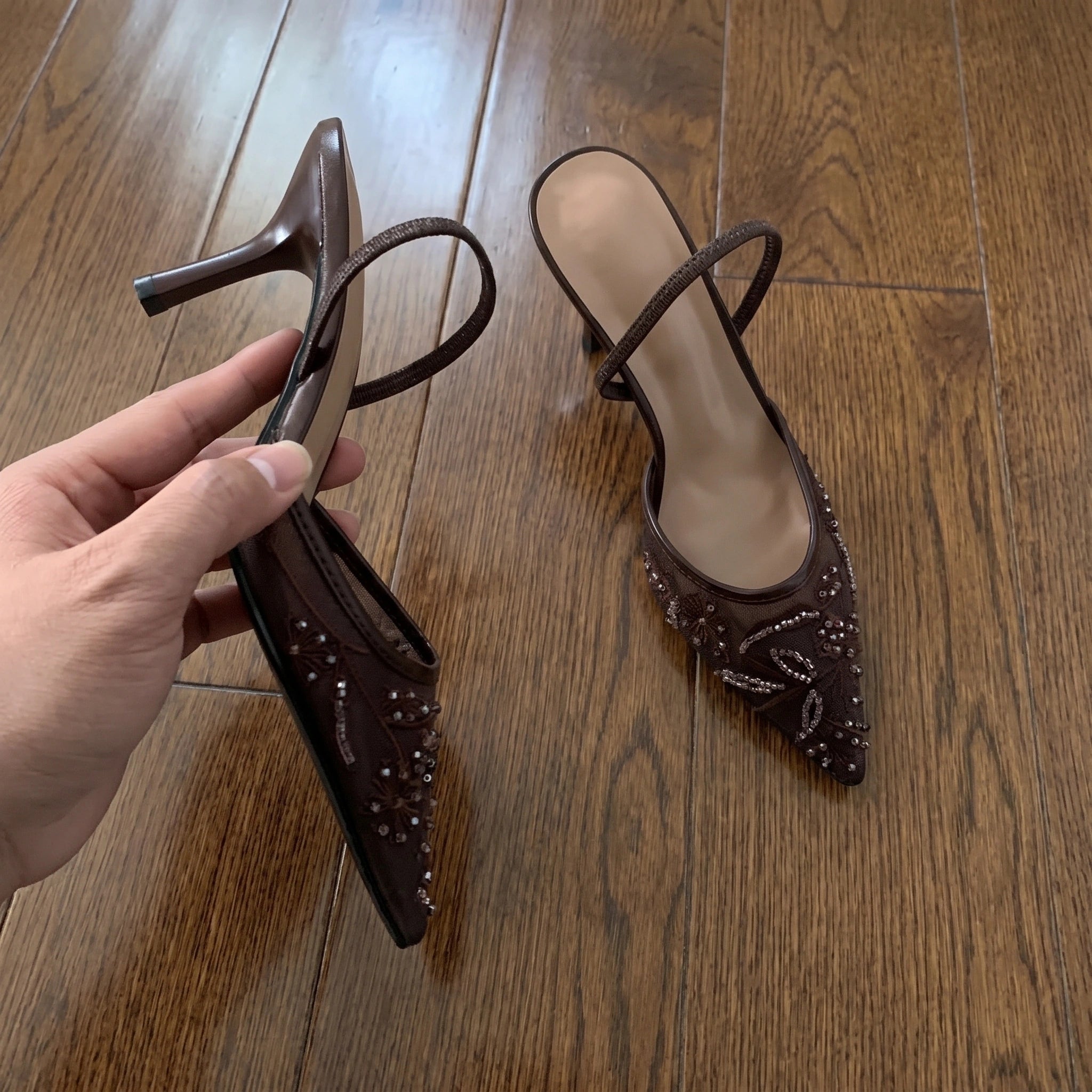 Close up view of the Amelia women's sexy summer heeled sandals showing the intricate stitching and luxurious fabric against a soft neutral background.
