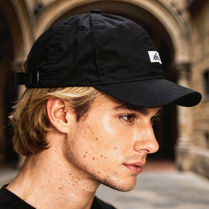View of a stylish men's baseball cap in dark gray, featuring breathable fabric and a curved brim