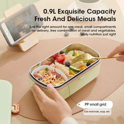View of a compact insulated electric lunch box in sleek gray, showcasing the lid, steam vent, and user friendly design