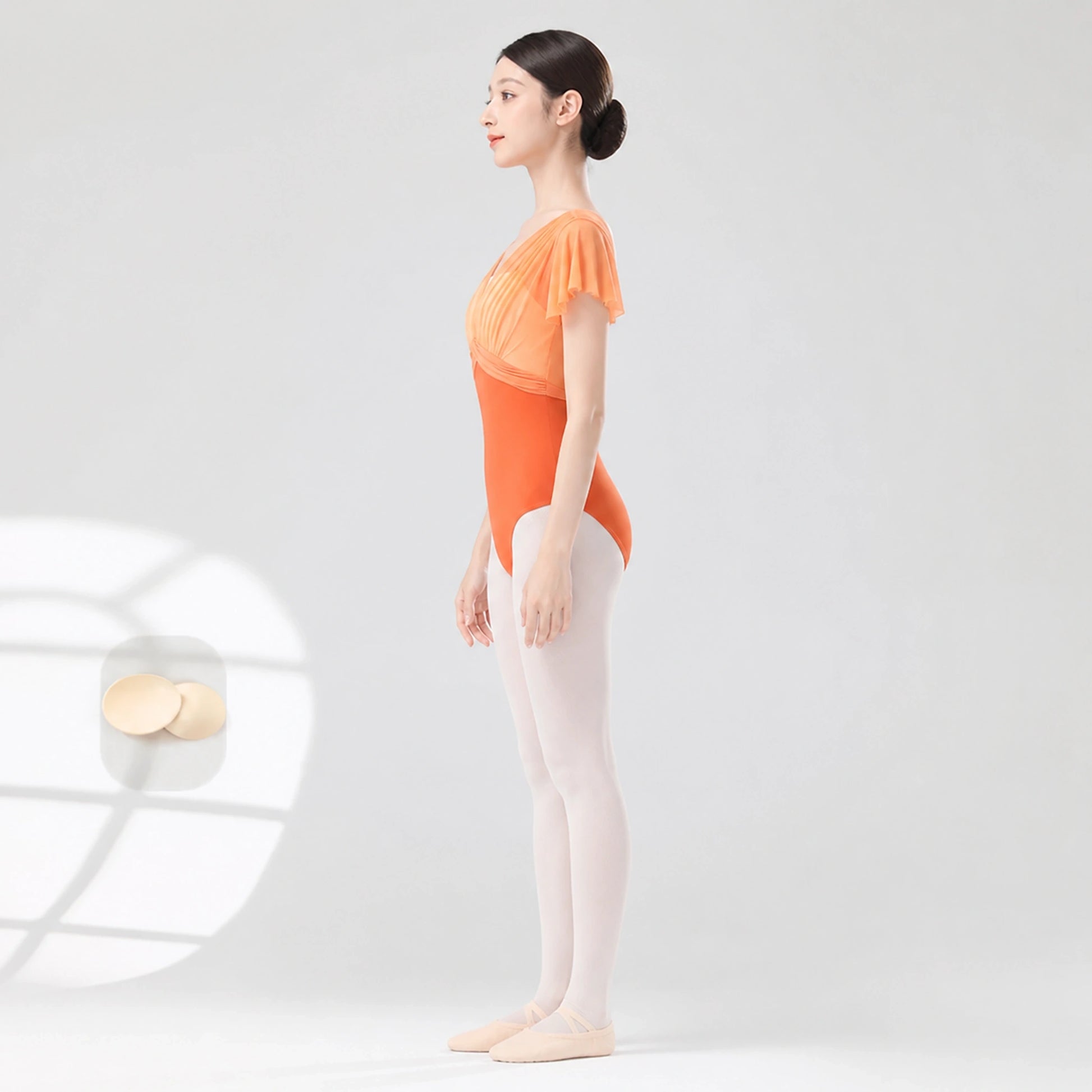 Bright orange ballet leotard side profile — view 6