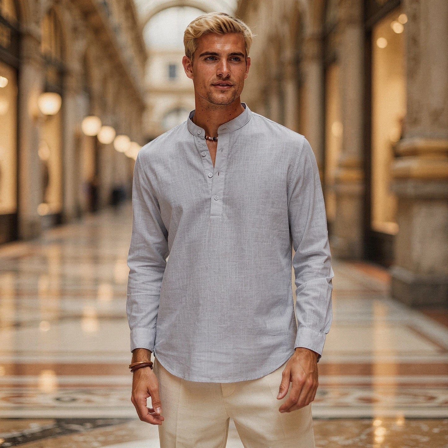 Lightweight casual henley shirt in soft cotton, featuring a relaxed fit, button placket, and long sleeves in light gray